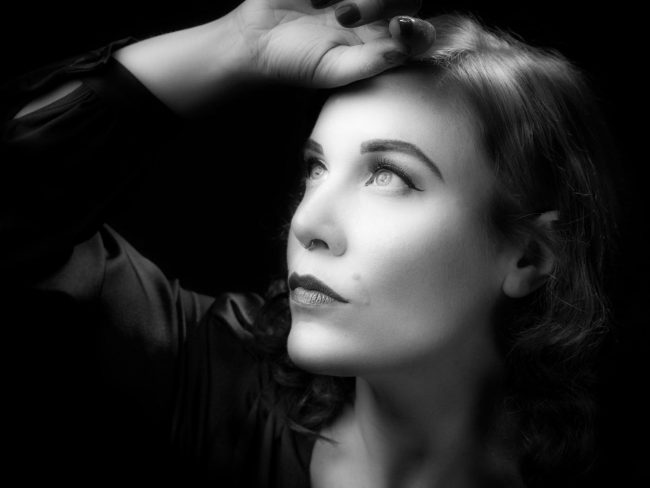 black and white studio portrait of a female model